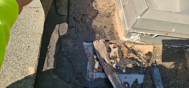Damaged roofing around a roof penetration
